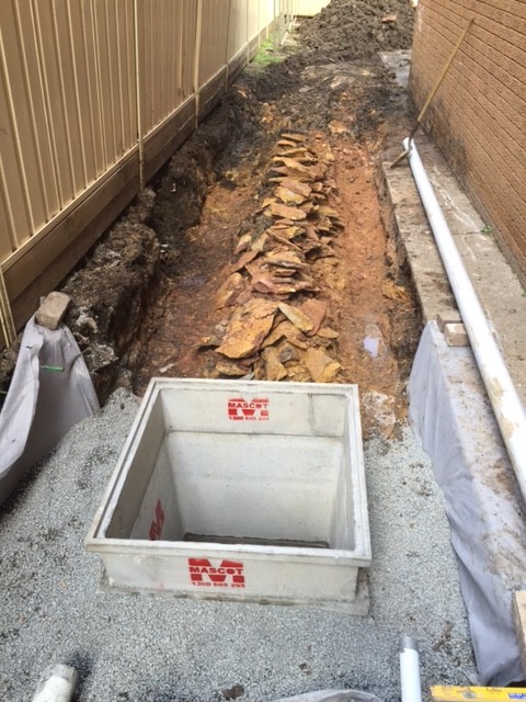 The trenches for the Agg lines on the south side of the pit also needed to be cut into the sand stone.