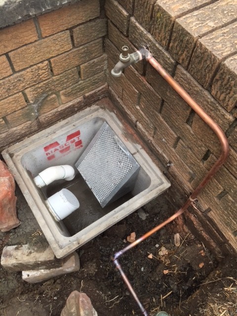 The new 450 boundary pit with 50mm pump out line from 900 pit at back of property, existing building down pipes re directed to pit with vermin flap valve (as per plan from hydraulic engineer) and a trash screen over the 109x75 RHS out let pipe to the the street kerb.