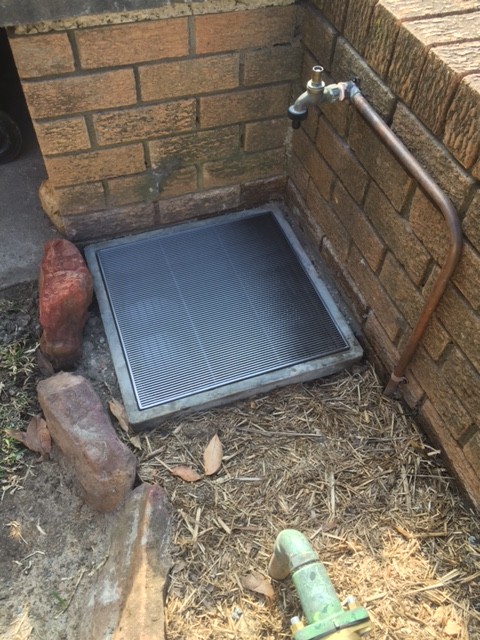 The supply and install of the new stainless steel heel guard 450 grate on the front boundary pit as requested by the hydraulic engineer in the scope of works. Also we moved the garden hose tap from the front of the building to the front wall above the new boundary pit.