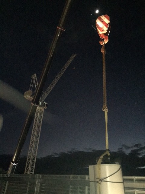 The new HWU getting lowered into the roof. 