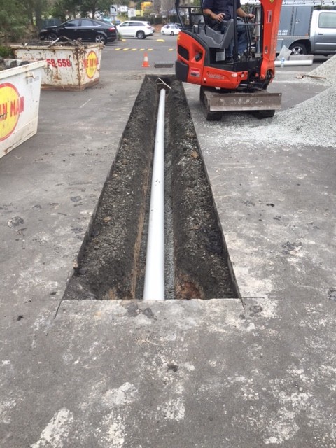ll the excavated material we placed in skip bins and got rid of. Once we replaced the damaged section of drainage we backfilled with 10mm blue metal and the road base. We compacted using a plate compactor ready for the bitumen.
