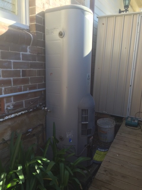 We disconnected and removed the old storage hot water unit and organized it to be removed from site.
