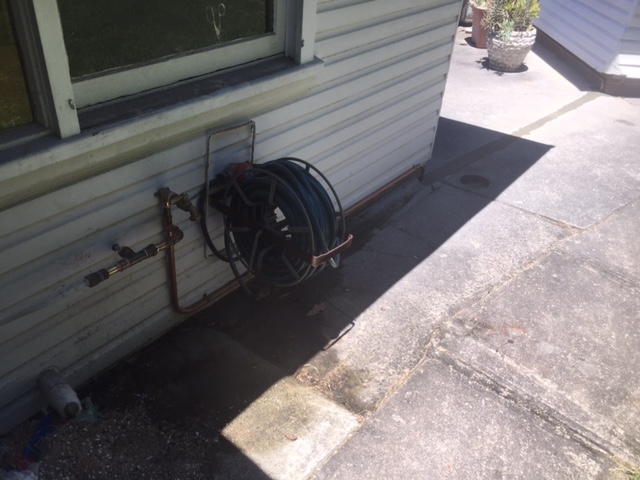 We diverted a new 20mm copper water service to the garage and disconnected the old rusted gal service.