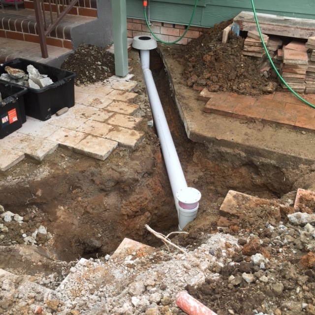 We installed a new overflow gully under the hose back hose tap. The house didn't have an overflow gully, so when the sewer blocked it overflowed inside the house. We are not sure how this drainage ever got passed by Sydney Water??