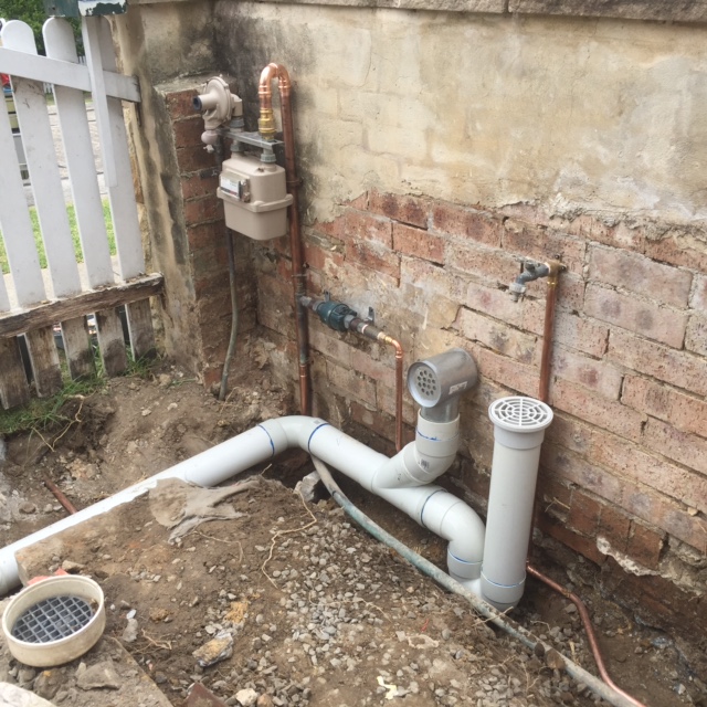  CMF moved the sewer overflow gully and low level vent from the driveway across to the side boundary wall so the driveway could be widened. We also moved the gas and water meters to the side boundary wall also.